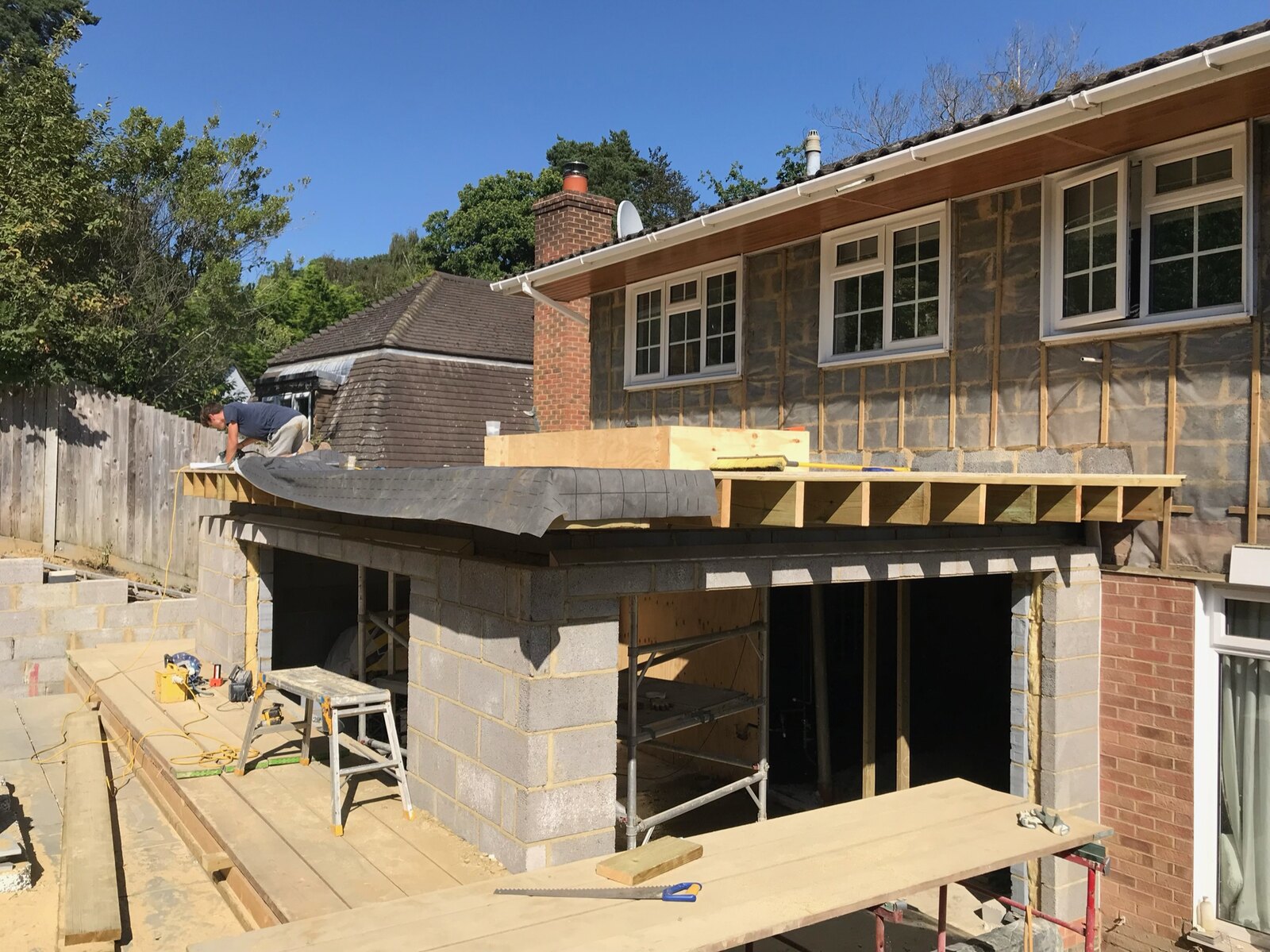 Substantial rear extension in progress, showing blockwork and roof construction