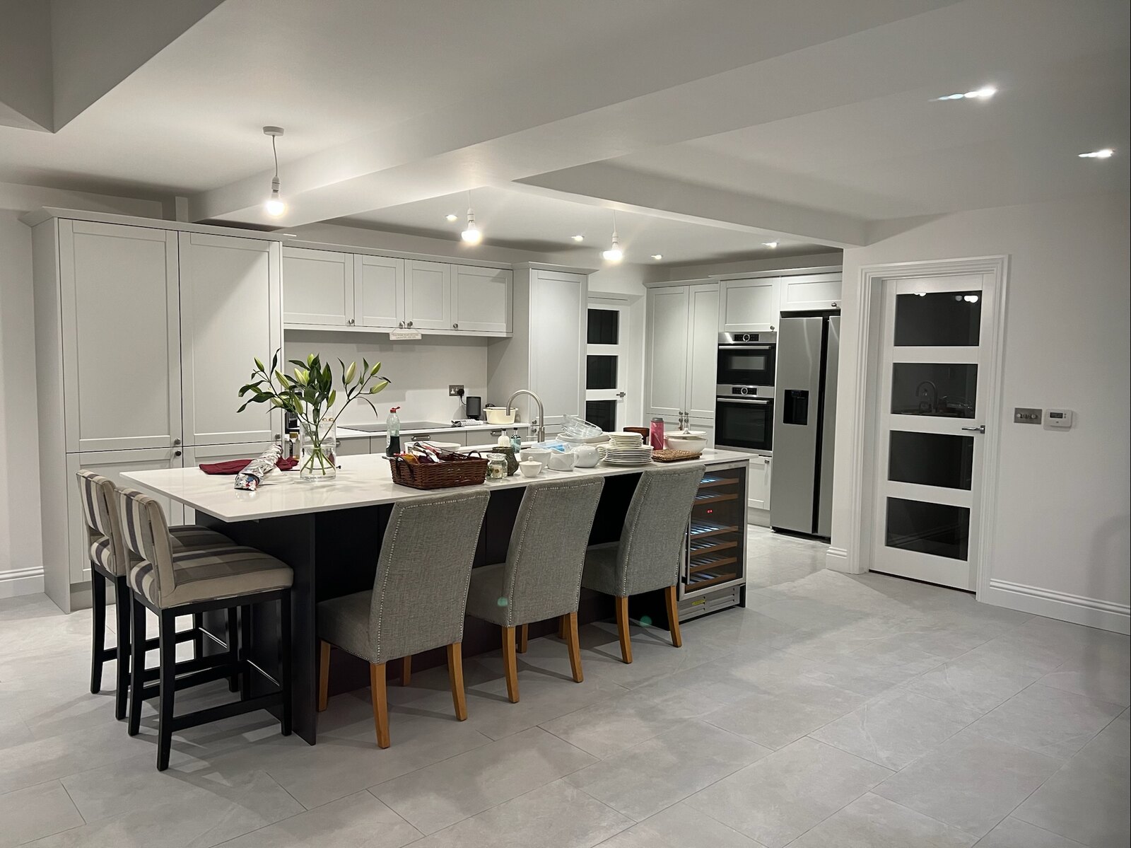 Bright completed kitchen and dining space with an island